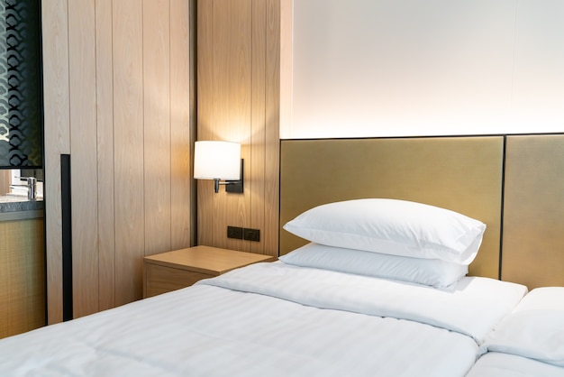 white pillow decoration on bed in hotel resort bedroom