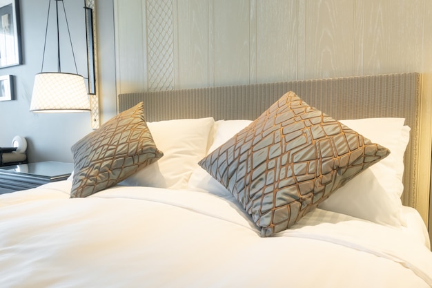 white pillows decoration on bed in bedroom