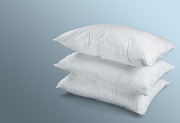 White Pillows Pile on grey background