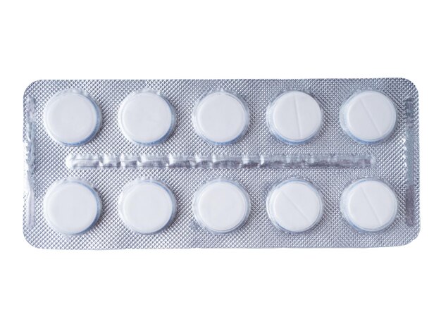 White pills in a grey blister pack Closeup