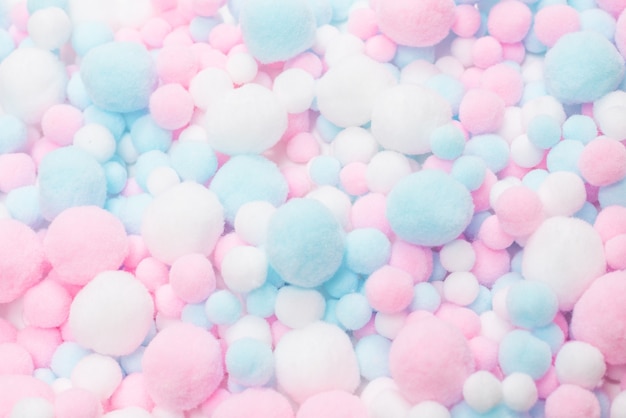 White, pink and blue soft pompons 