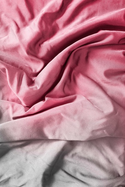 White and pink draped fabrics closeup as a background