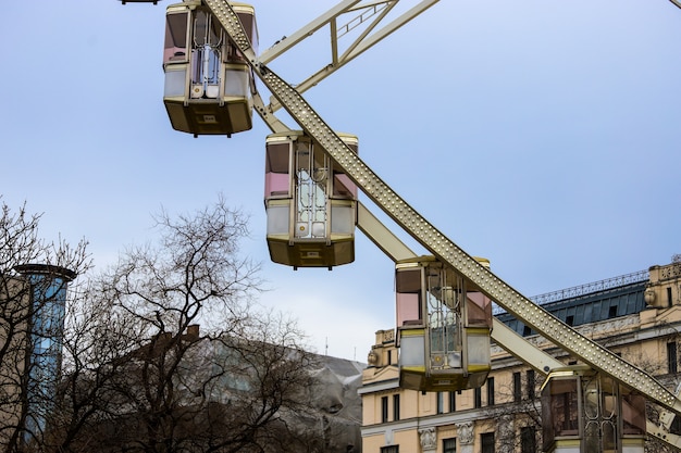 white and pink Ferris wheel cabins