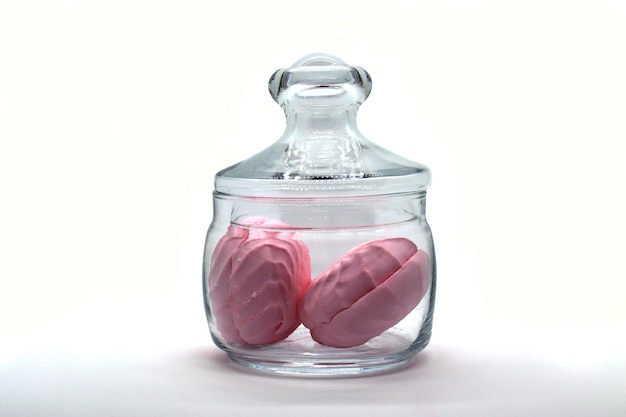 White and pink marshmallows in a glass jar