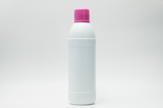 White plastic bottle with pink cap isolated on white background with copy space and blank label. Cleaning products container. Bathroom cleaner bottle.  Household Chemical bottle for cleaning toilet.