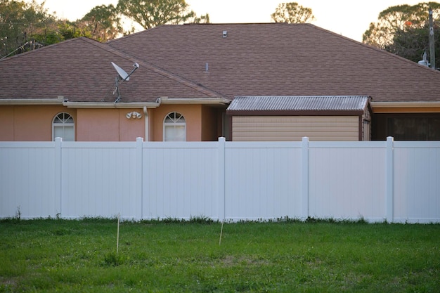 White plastic fence for back yard protection and privacy