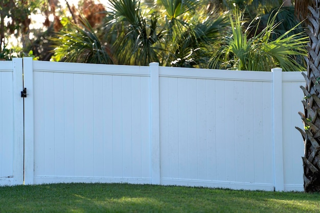 White plastic fence for back yard protection and privacy