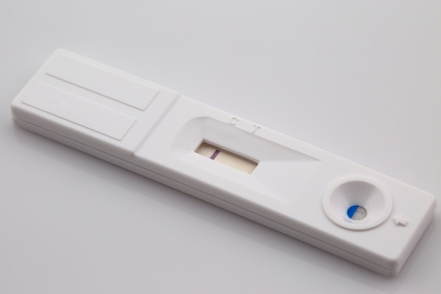 White plastic pregnancy test isolated on white background