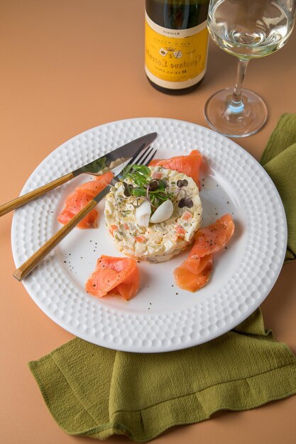 White plate and Smoked fish with Risotto Dish meal and women hand Leaf vegetable salad