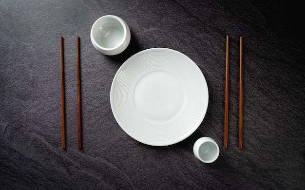 White plate with chopstick top view mockup