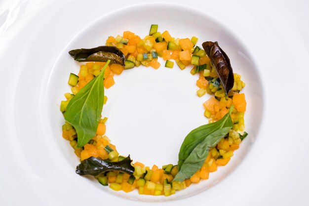 a white plate with corn and beans on it and a circle of corn