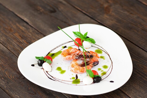 White plate with fried shrimps in restaurant