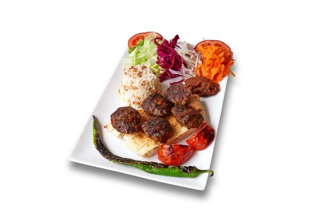 Photo white plate with kefta and vegetables isolated on withe