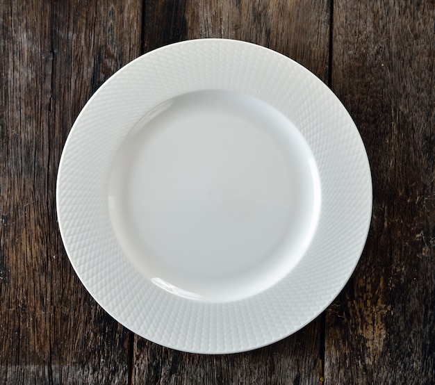 White plate on wooden