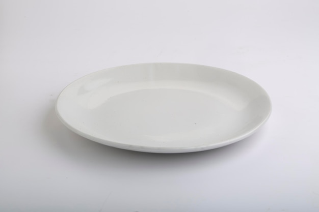 White plates different types of white ceramic plates with different shapes on a white background