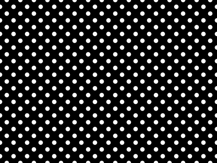 White polka dots over black background