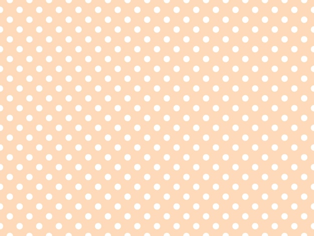 White polka dots over peach puff background