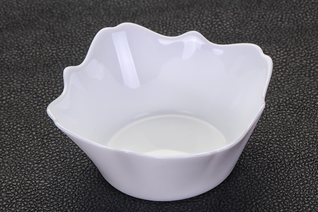 White porcelain bowl over black background