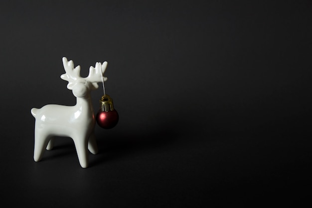 White porcelain raindeer on black backgound