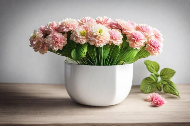 a white pot with pink flowers on a wooden table