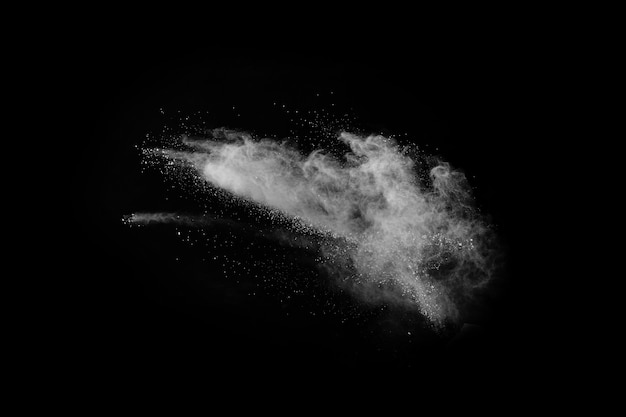 White powder explosion on black background. colored cloud. colorful dust explode. paint holi.