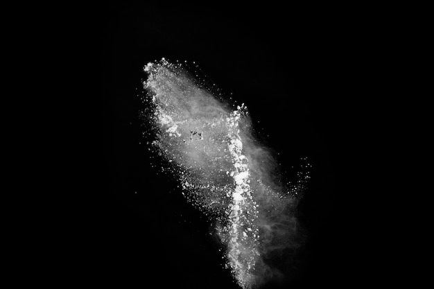 White powder explosion on black background. Colored cloud. Colorful dust explode. 