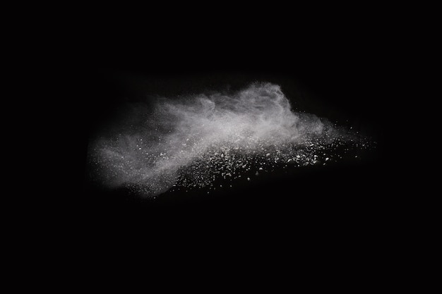 White powder explosion on black background. Colored cloud. Colorful dust explode. 