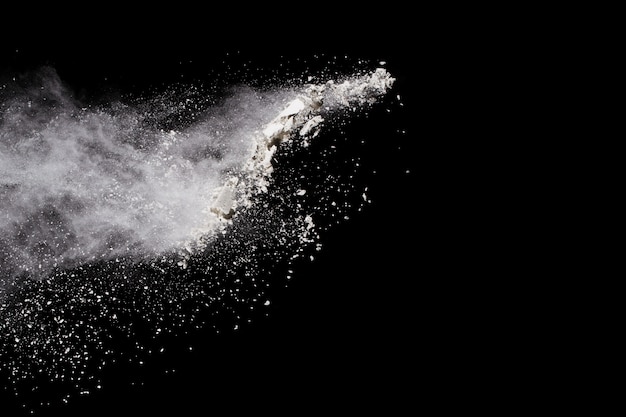 White powder explosion on black background.  