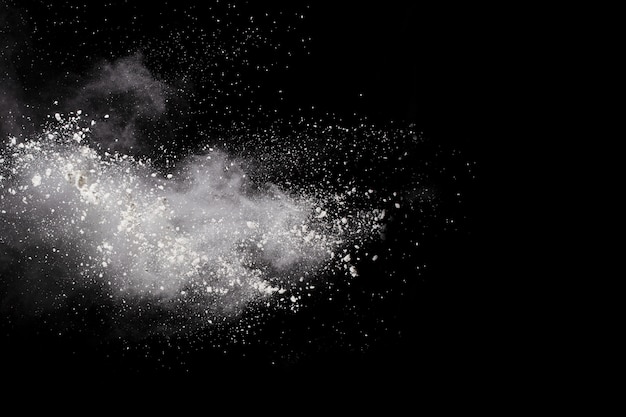 White powder explosion on black background.  