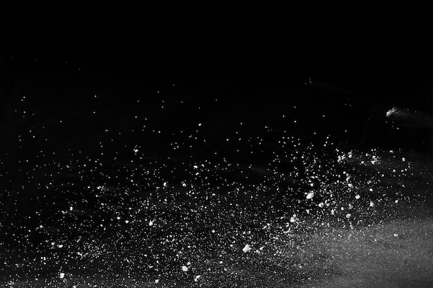 White powder explosion on black background.  