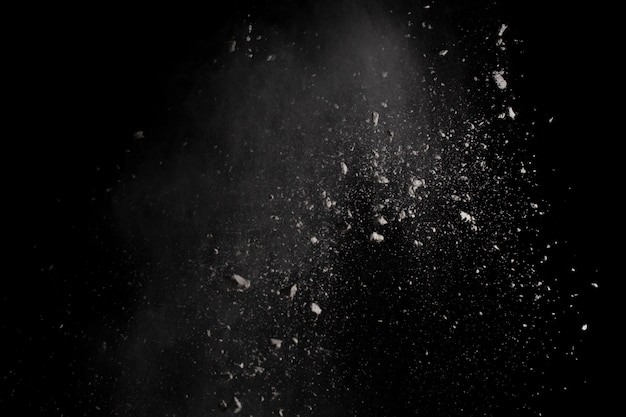 White powder explosion on black background.  