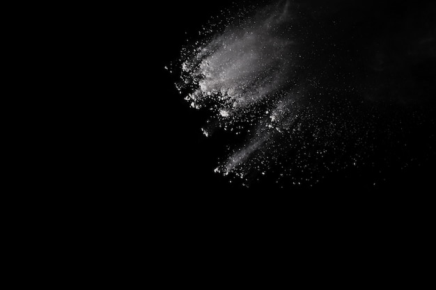 White powder explosion on black background.  