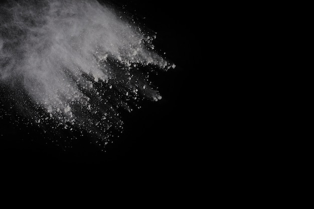 White powder explosion on black background.  