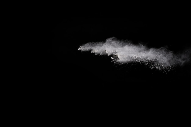 White powder explosion on black background.  