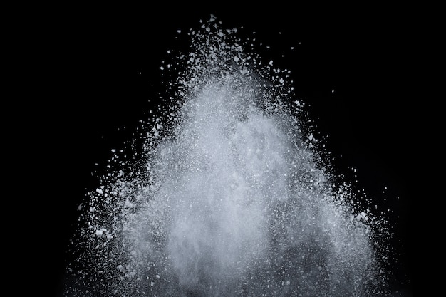 White powder explosion on black background. 