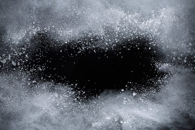 White powder explosion on black background.  