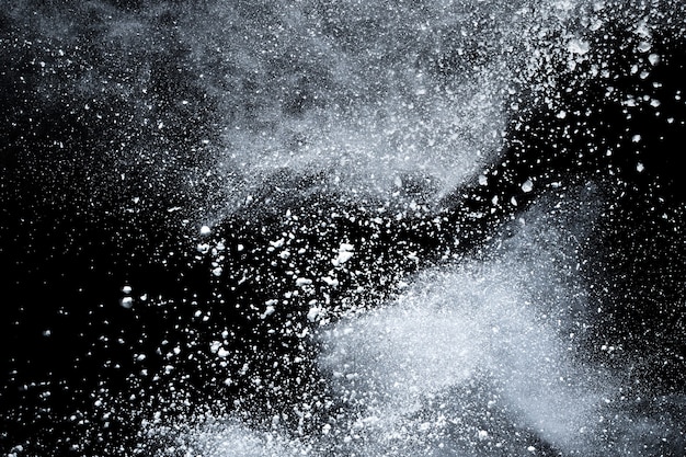 White powder explosion on black background