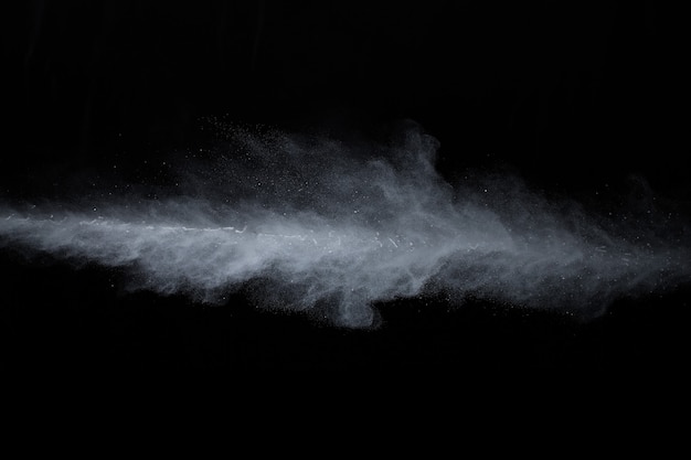 White powder explosion on black background