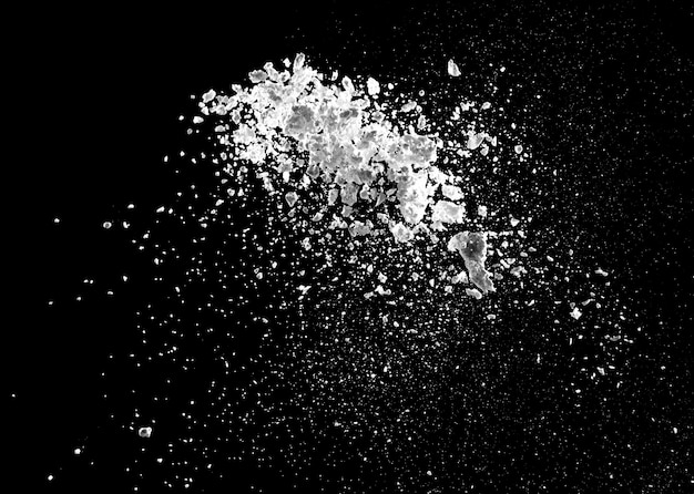 White powder explosion isolated on black