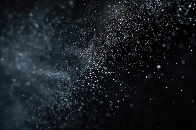 Photo white powder freeze motion on black background abstract falling particles