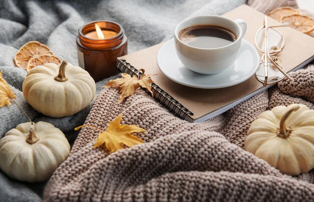 White pumpkins coffee and autumn leaves