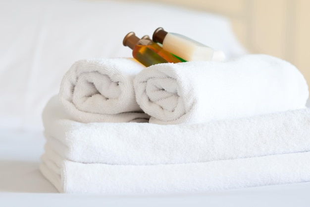 White pure towels on bed in the hotel