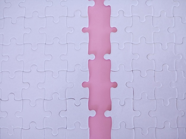 white puzzle paper on the pink background