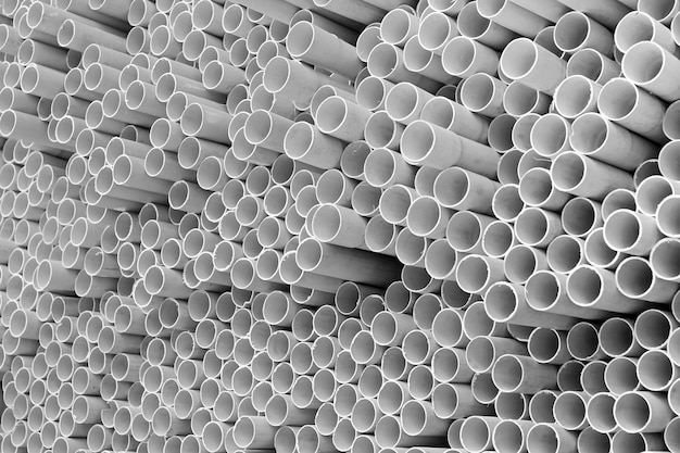 White PVC pipes stacked in construction site