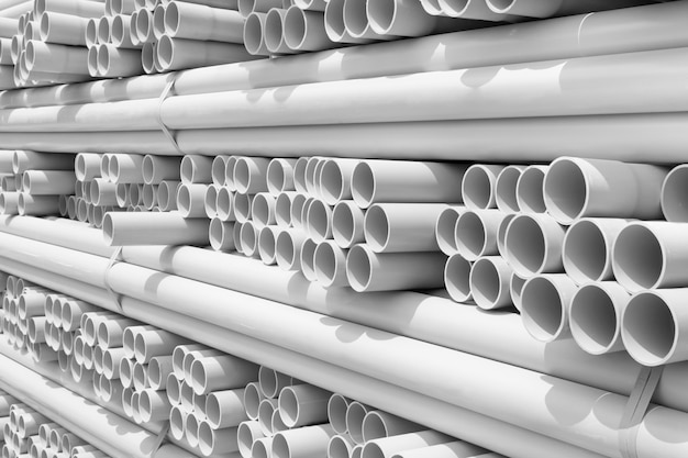 White PVC pipes stacked in construction site