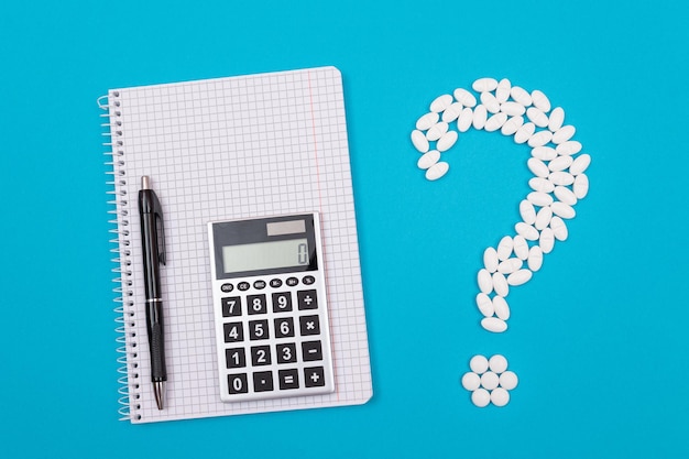 White question mark and calculator pharmaceutical industry and medicinal products