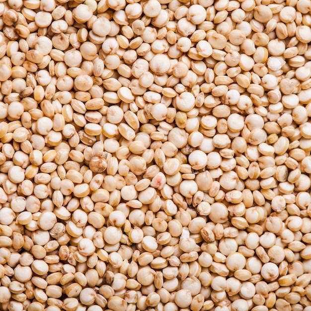 White quinoa seeds top view as a background