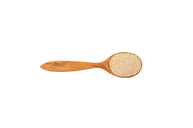 White Quinoa seeds in wooden spoon on white background Top view Design element