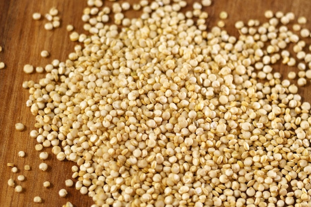 White quinoa uncooked seeds texture close up macro selective focus