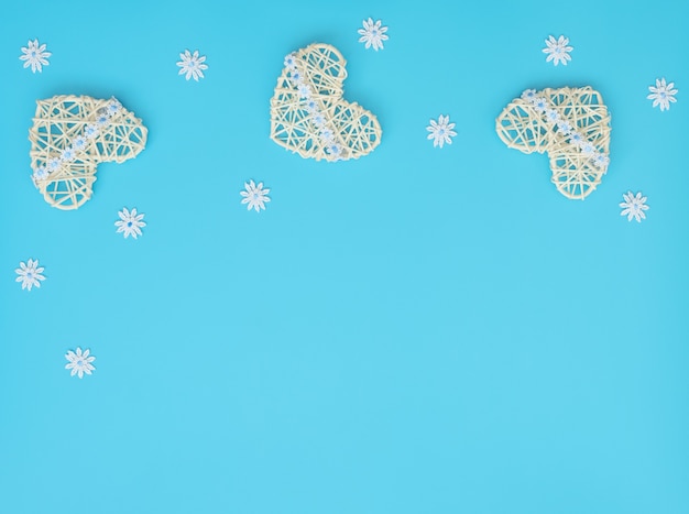 White rattan hearts with ribbon and lace flowers